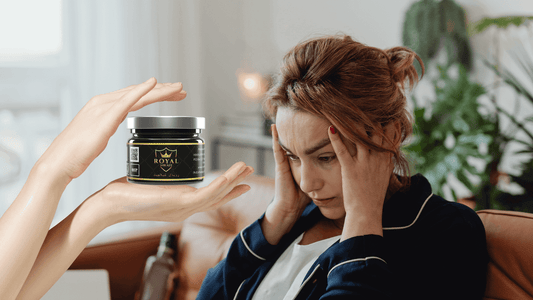 Woman experiencing stress while a hand presents a jar of Royal Shilajit for relief.